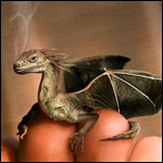Драконы Маленький дракон сидит на пальцах руки, из ноздрей идет дым аватар