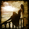 Море Девушка сидит на парапете и смотрит на закат над морем аватар