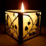 Салют, свечи, фонари Горящая свеча в прозрачном подсвечнике с черными узорами аватар